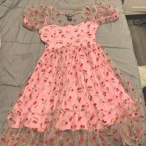 Pink cherry glitter ruffle dress with a pink bow on the back